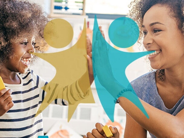 A mother and her child playing with toys together.